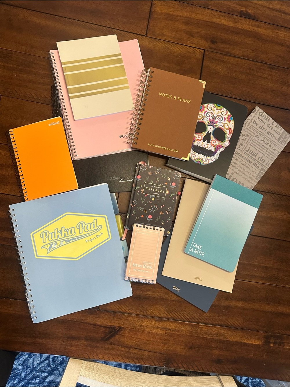 Lot of notepads and planner type pads.